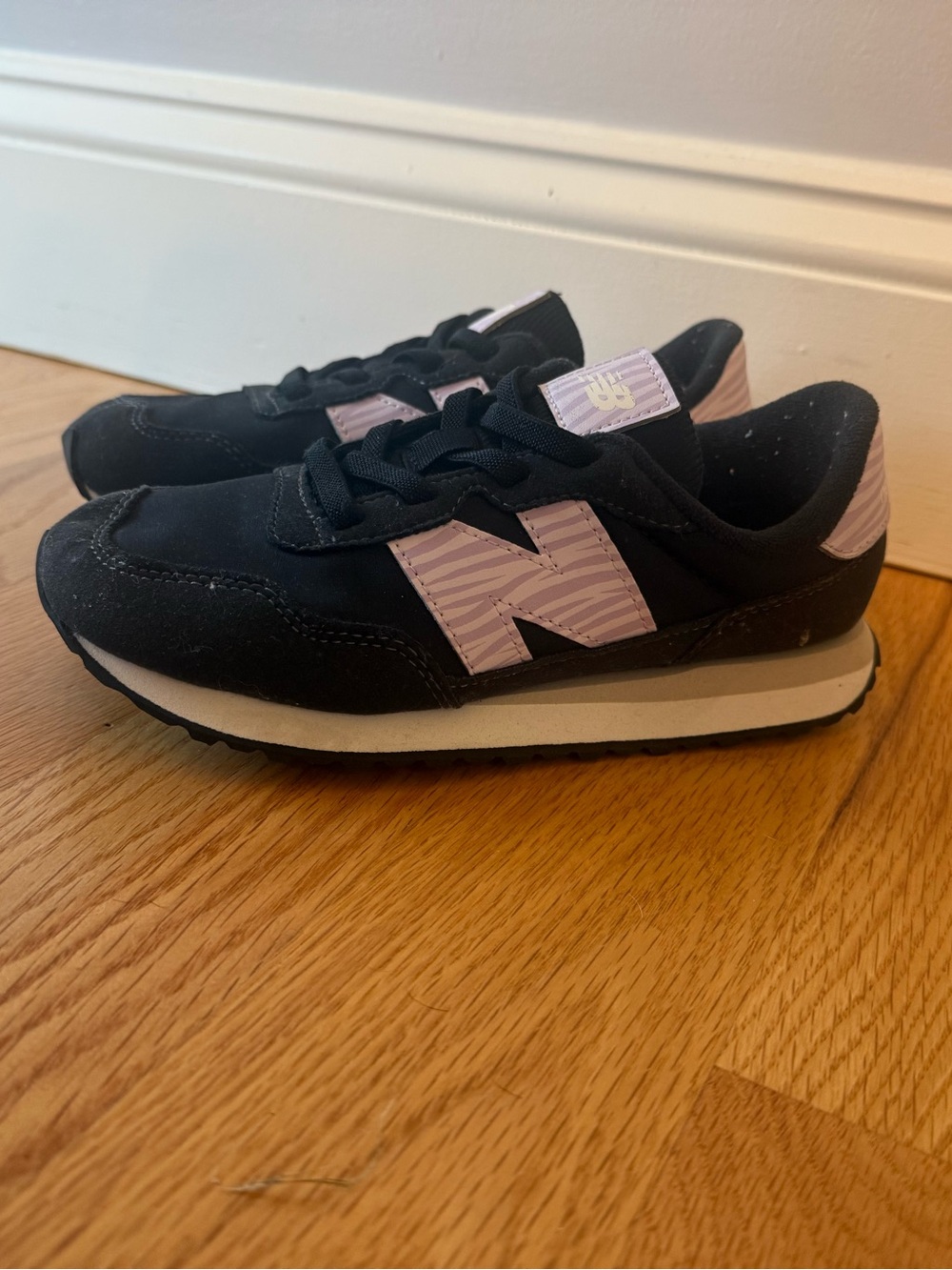 New Balance Kids Black Sneakers with Light Purple 'N' Detail